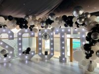 balloon-garland-over-light-up-letters