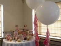 Candy buffet with jumbo balloons with tassels
