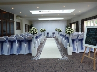aisle carpet with faux rose trees at Prested Hall