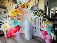 Baby-in-bloom-sailboard-and-garlands