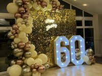 light-up-60-with-gold-sequin-wall