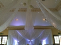 Grecian backdrop with ceiling drapes